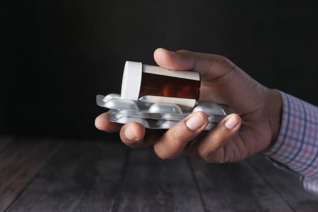 Close-up of a hand replacing expired medications in a first aid kit, with a focus on the expiration dates and the act of discarding old items and adding new ones.
