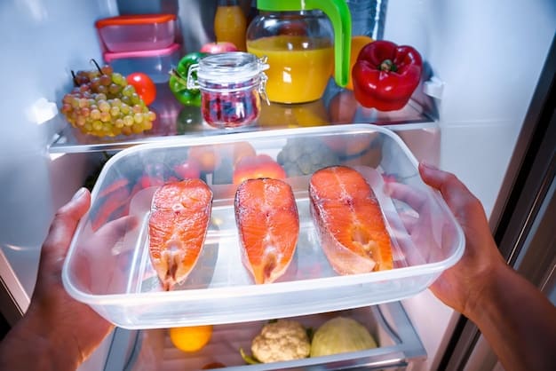 A person organizing food items inside a cooler with ice packs during a power outage. A food thermometer is visible next to the food.