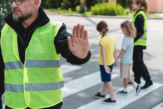 A school crossing guard participating in a training session, learning proper hand signals and traffic control techniques from a certified instructor. Other trainees are observing and practicing alongside them.