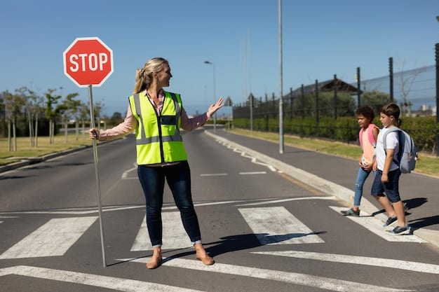 A school crossing guard assisting students across a busy street, with clear visibility and proper signage. The crossing guard is wearing a bright vest and holding a stop sign.