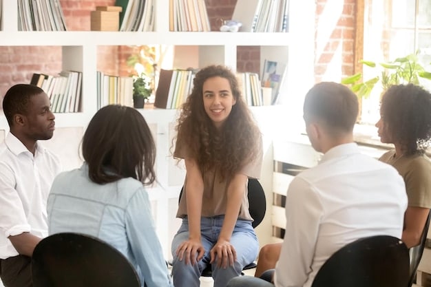 A group of students participating in a peer mediation session with a school counselor. The setting is a quiet room within the school, and the atmosphere is one of active listening and problem-solving. The students are diverse, and the counselor is guiding them through a structured conversation to resolve conflict.