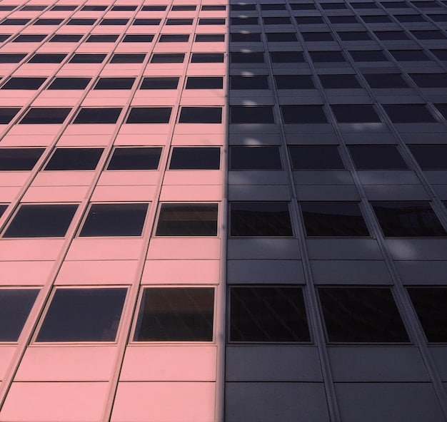 A split image comparing two different types of properties: On one side, a modern office building representing a commercial property, and on the other side, a luxury apartment complex representing residential investment. The split emphasizes the concept of 'like-kind' exchange.