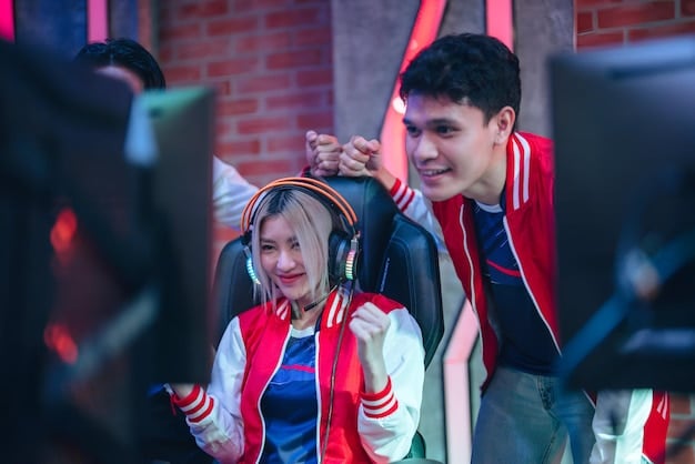 A photograph of high school students competing intensely in a dedicated esports arena. Students are focused on their computer screens, wearing gaming headsets, and the atmosphere is filled with excitement and energy. The backdrop shows a large screen displaying the game in progress.