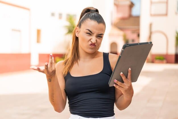 A young athlete is depicted thoughtfully composing a social media post on their tablet. They are surrounded by motivational posters with messages about integrity, sportsmanship, and respect. The setting is a clean, well-lit study area.
